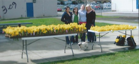 Courtney's friends hand out bouquets at the second annual event